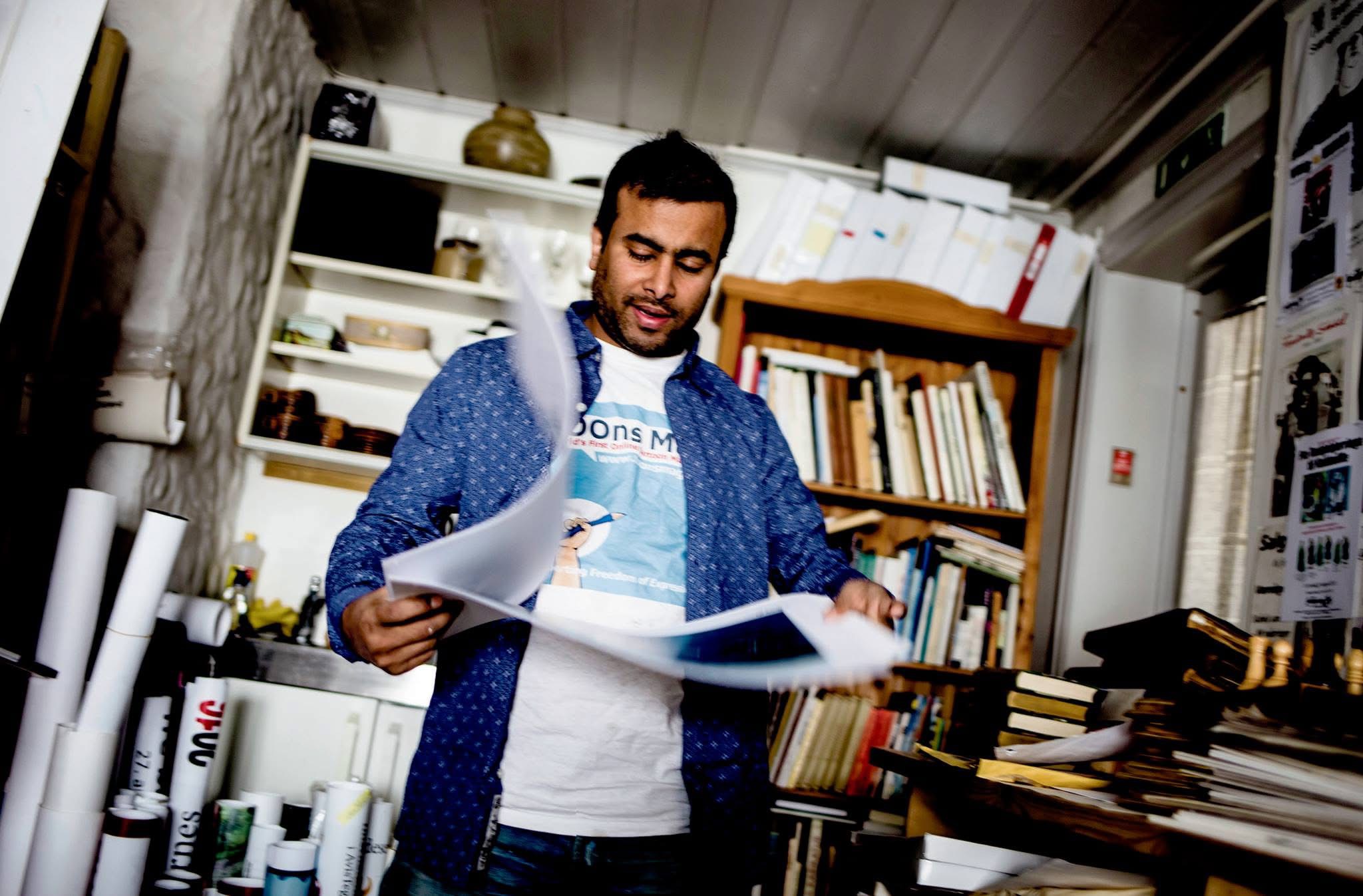ARiF reviewing printed work in his studio